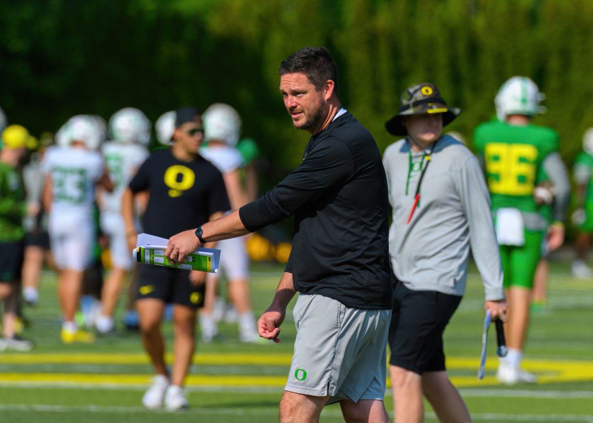 Oregon Head Coach Dan Lanning speaks to players during a drill. The University of Oregon Football team conducted their 17th fall practice on August 23, 2023, on the practice fields at Hatfield-Dowlin Complex, in Eugene, Oregon. (Eric Becker/Emerald)