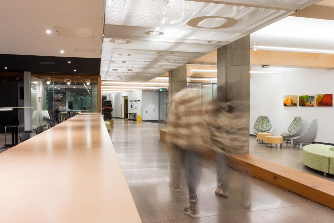 Students walk through the lobby in Kalapuya Ilihi. RAs across campus are bringing up disparities between dorm culture and how that affects their workloads. (Molly McPherson/Daily Emerald)&#160;&#160;&#160;