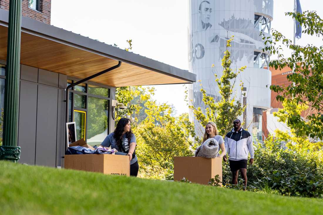 Students push carts of their things along the sidewalk as they move into one of the new dorms on campus. For the majority of students living on campus, fall move-in took place on Sept. 21 and 22, 2023. (Molly McPherson/Emerald)