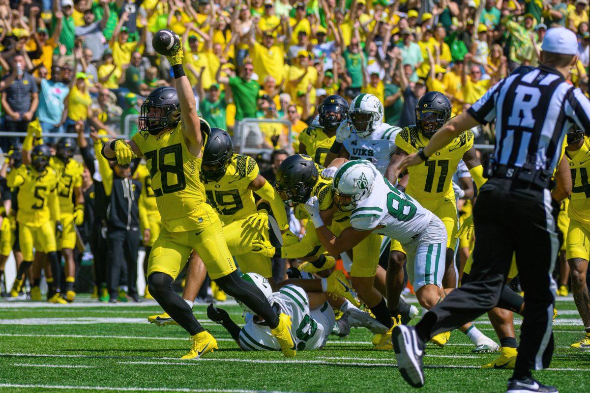 Bryce Boettcher celebrates after recovering a fumble. The University of Oregon Ducks Football team defeated the Portland State University Vikings in a home match at Autzen Stadium in Eugene, Oregon, on September 2, 2023. (Eric Becker/Emerald)