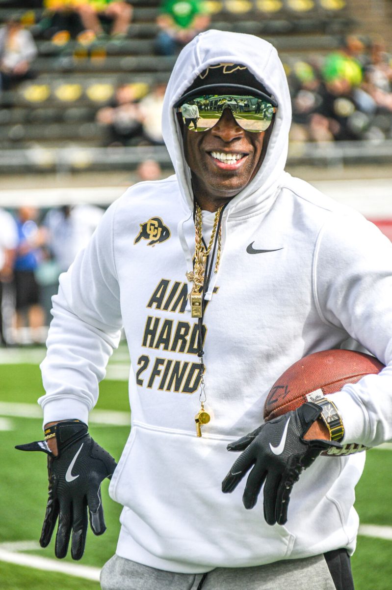 Colorado Head Coach Deion Sanders throws a football pregame. The University of Oregon Ducks Football team defeat the University of Colorado Buffaloes 42-6 at Autzen Stadium in Eugene, Oregon, on September 23, 2023. (Kai Kanzer/Emerald)