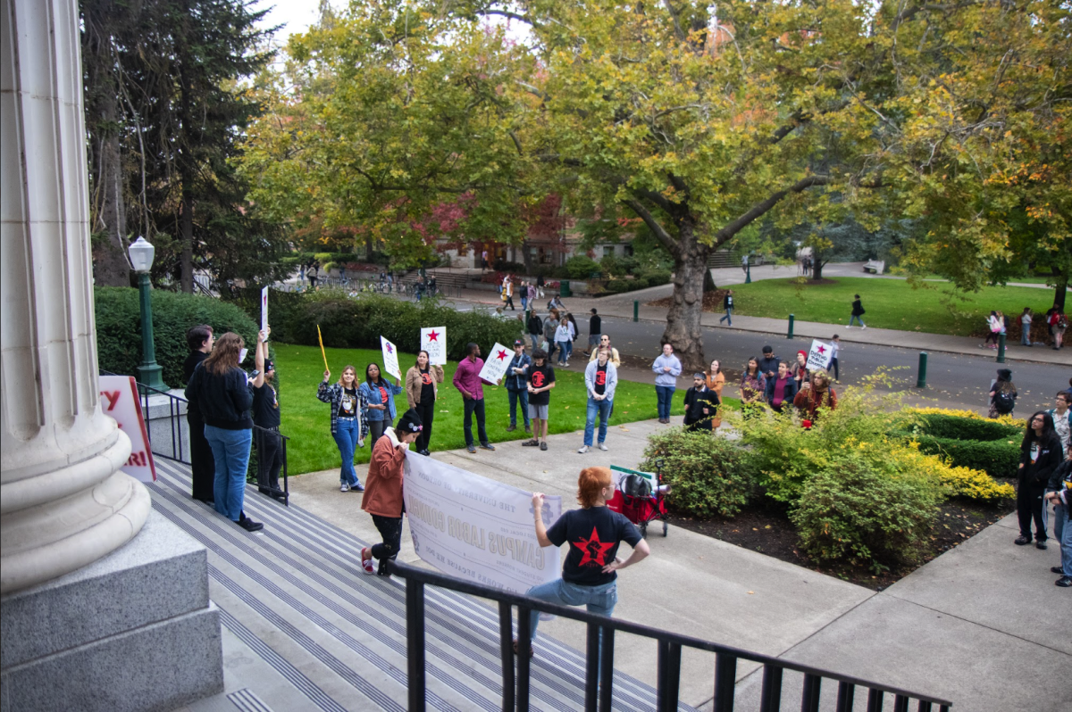 GTFF and UOSW members gather on the steps of UO&#8217;s Johnson Hall in protest for contract revisions and fairer pay. (Eliott Coda/Emerald)