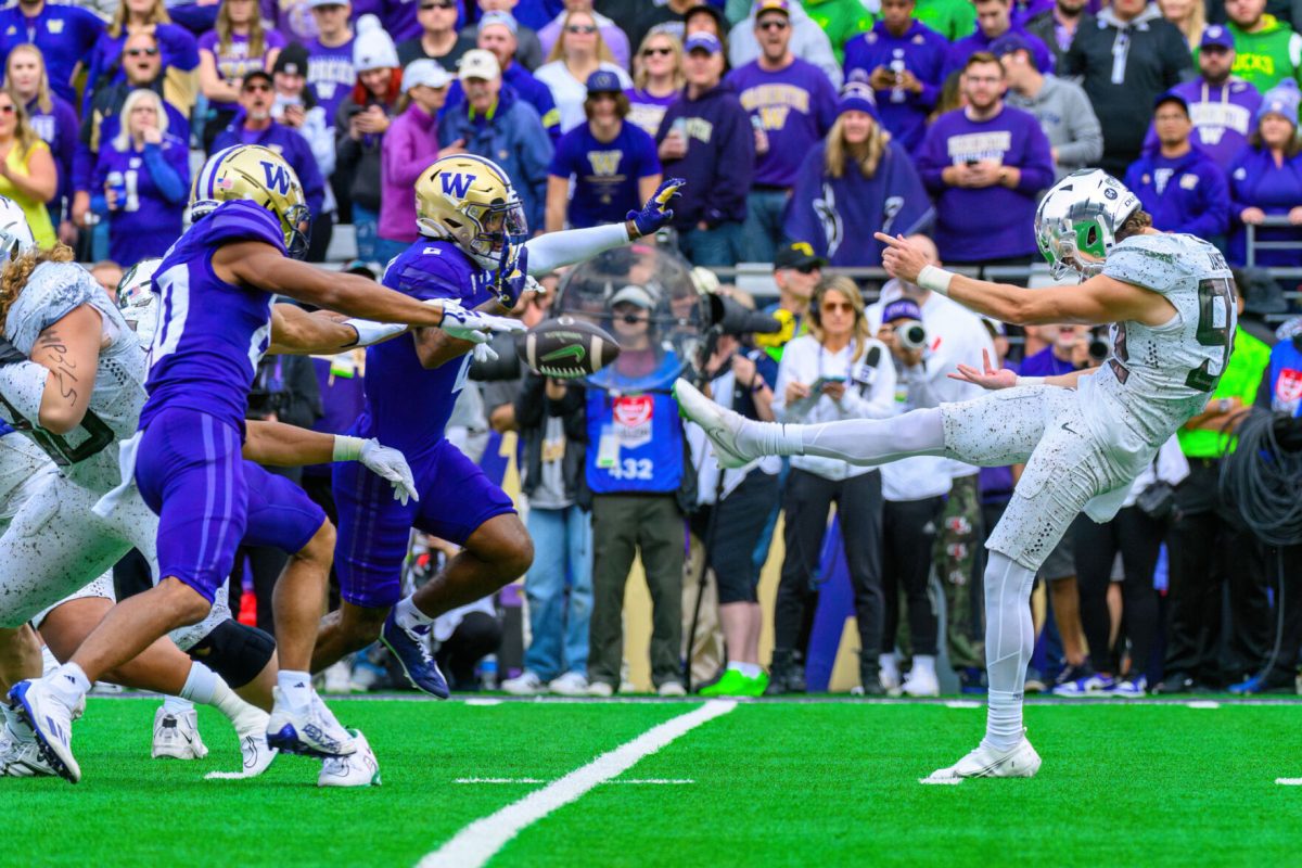 Ross James (92) punts the ball. The University of Oregon Ducks Football team were defeated by the University of Washington Huskies in an away match at Husky Stadium in Seattle, Washington, on October 14, 2023. (Eric Becker/Emerald)