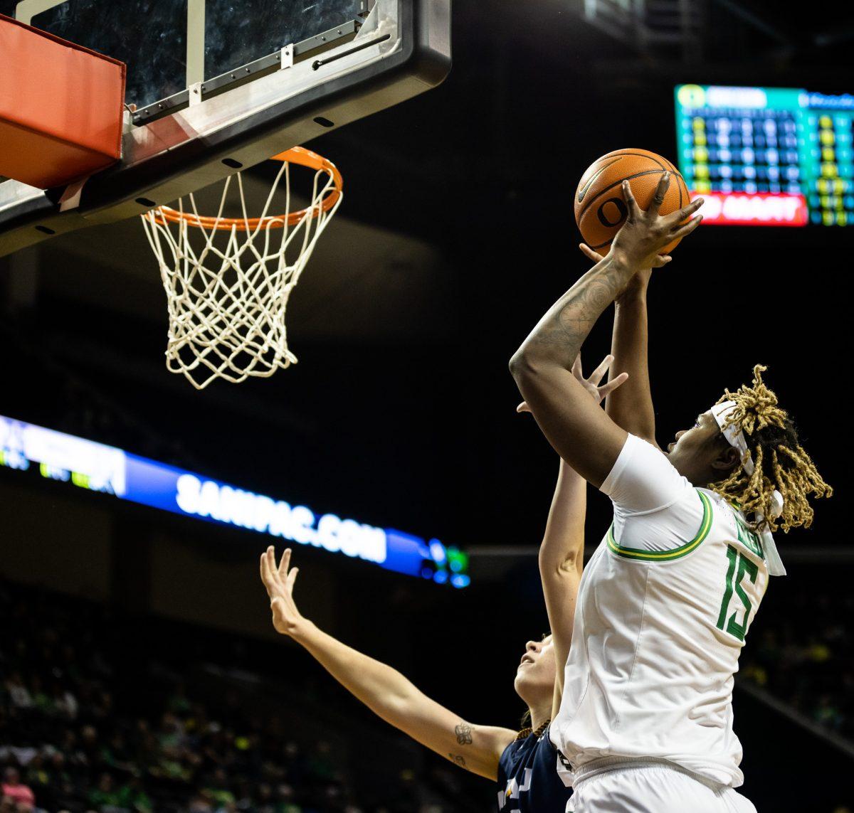 Oregon big, Phillipina Kyei (15), takes advantage of a size mismatch and drives to the basket.&#160;The Oregon&#160;Women's&#160;Basketball team host Northern Arizona for their season opener &#160;at Matthew Knight Arena in Eugene, Ore., on Nov. 6, 2023. (Jonathan Suni, Emerald)