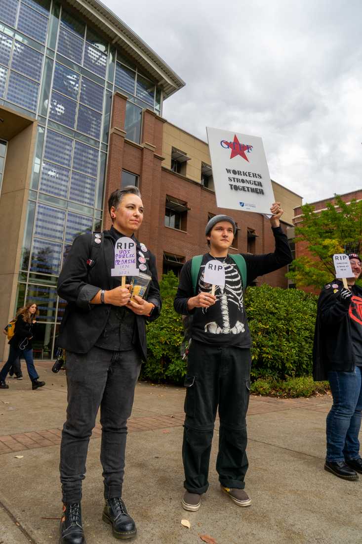 GTFF, The Graduate Teaching Fellows Federation, gathered today in formal funeral attire to &#8220;eulogize&#8221; UO&#8217;s public promise to fair wages and treatment of graduate employees. (Lulu Devoulin/ Emerald)