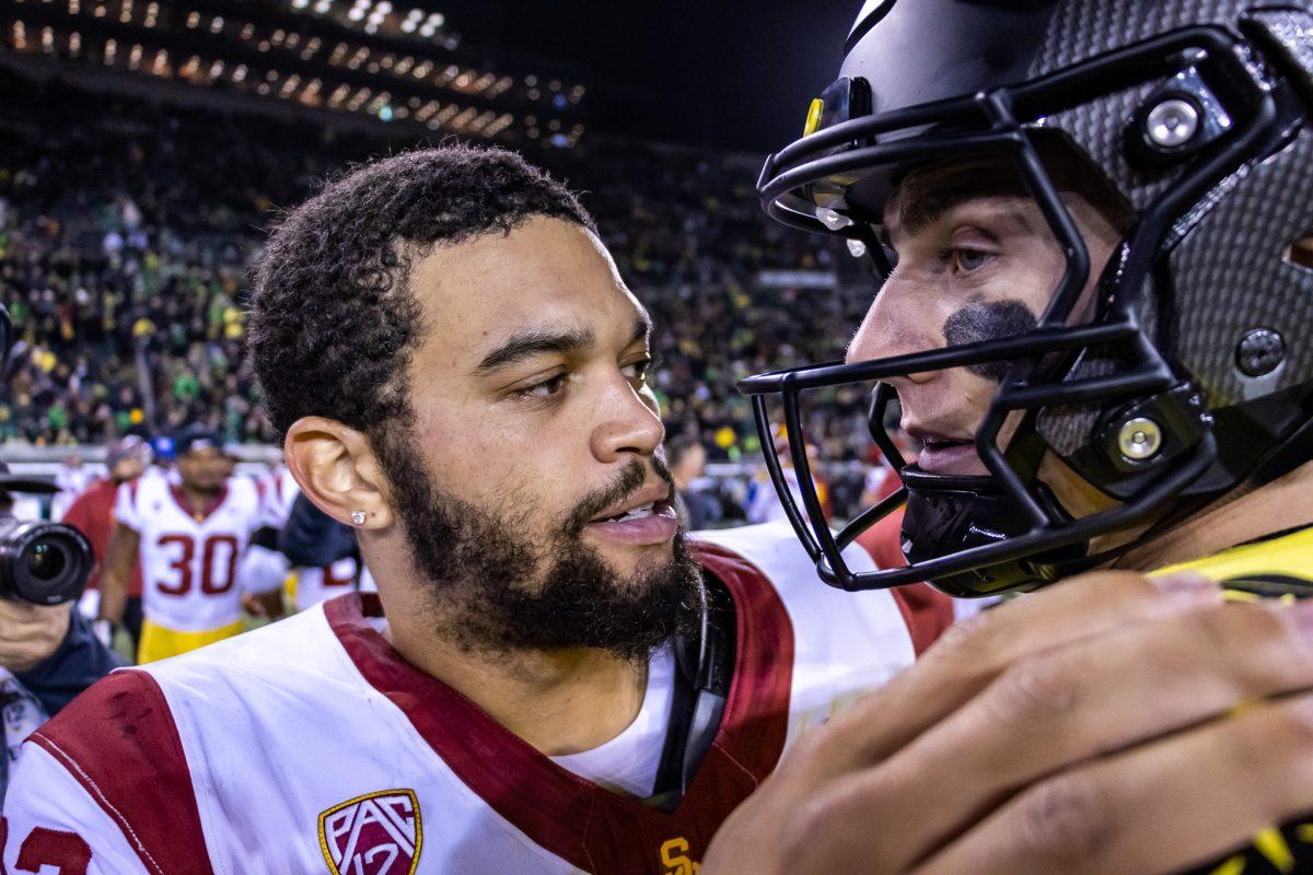 Last years Heisman winner, Caleb Williams, shows respect to the potential front runner for the 2023 season in Bo Nix after the game. (Jonathan Suni/Emerald)