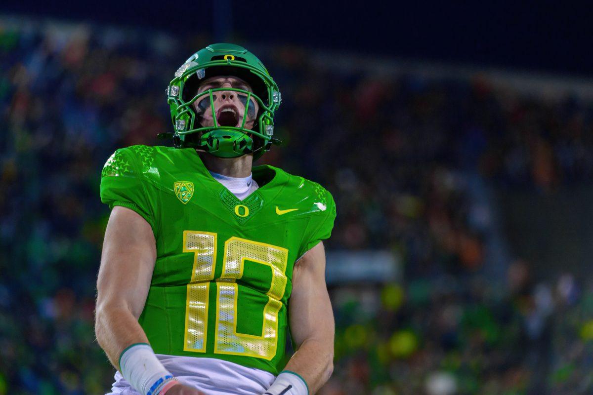 Bo Nix (10) celebrates after scoring a touchdown. The University of Oregon Ducks Football team defeated Oregon State University in a home match at Autzen Stadium in Eugene, Ore., on Nov. 24, 2023. (Eric Becker/Emerald)