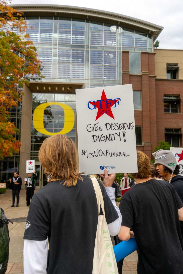 GTFF, The Graduate Teaching Fellows Federation, gathered today in formal funeral attire to &#8220;eulogize&#8221; UO&#8217;s public promise to fair wages and treatment of graduate employees. (Lulu Devoulin/ Emerald)