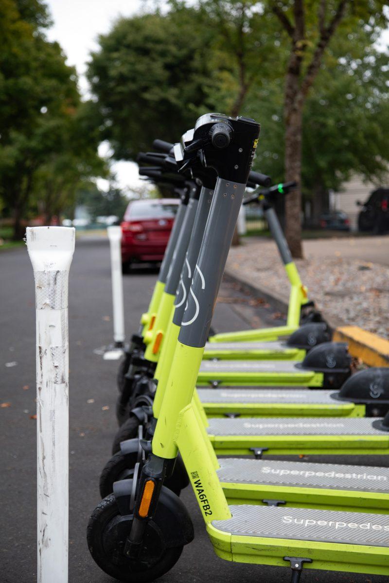 Superpedestrian scooters lined up in one of the many designated parking zones in Eugene, Ore. (Sebastian Flores/Emerald)&#160;