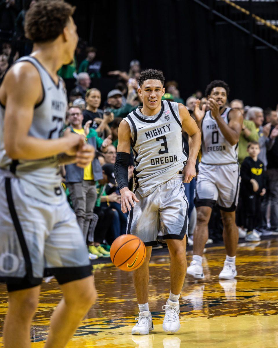 Jackson Shelstad (3) smiles at the end of the game as he and his freshman counterpart, KJ Evans (10), combine for over 40 points.&#160;The Oregon Men's Basketball Team host the USC Trojans to start their last season of conference play in the PAC-12 &#160;at Matthew Knight Arena in Eugene, Ore., on Dec. 28, 2023. (Jonathan Suni/Emerald)