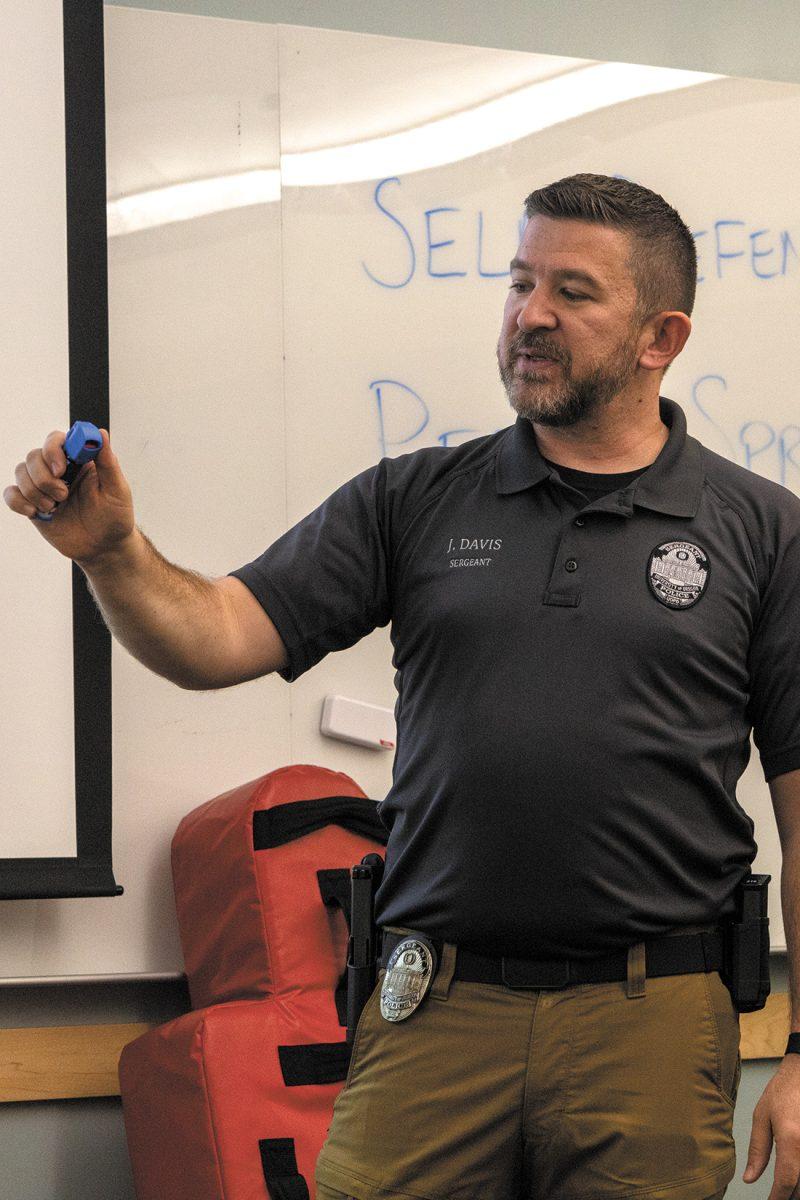 University of Oregon Police Department Sergeant Jared Davis teaches a self-defense and pepper spray course on Nov. 27, 2023 (Eliott Coda/Emerald)