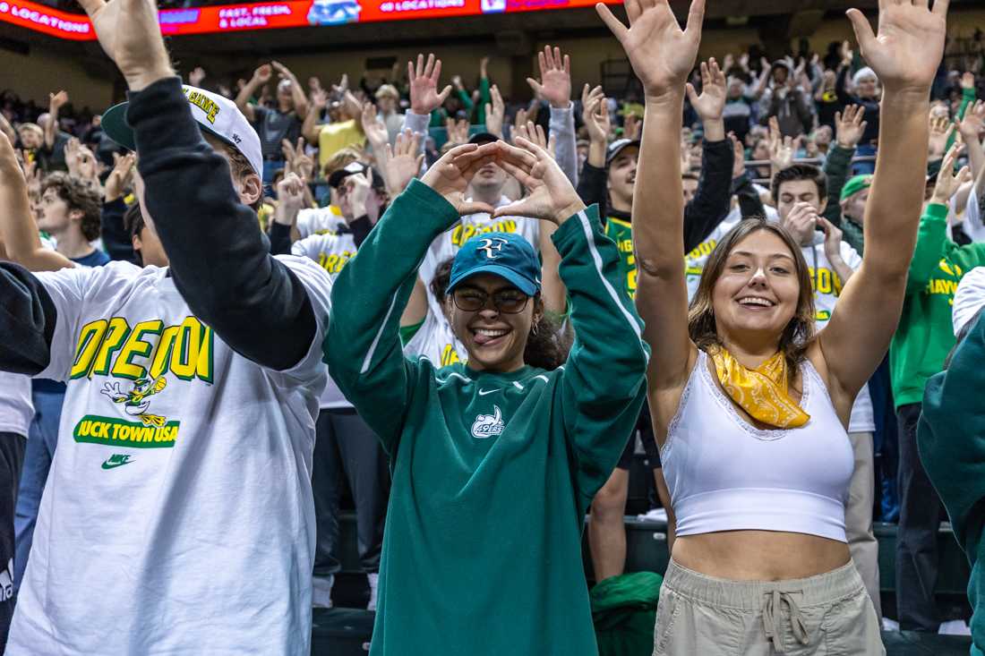 Fans dance to "Shout" during the second half of the game. The Oregon Ducks men&#8217;s basketball team takes on the Michigan Wolverines on Dec. 2, 2023, in Eugene, Ore. (Molly McPherson/Emerald)