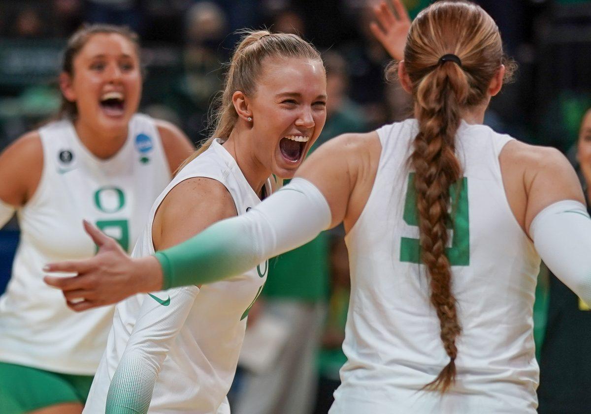 Daley McClellan (4) yells in excitement after winning a point. Oregon Volleyball take on the University of Hawaii at Matthew Knight Arena in Eugene, Ore. on Dec 1, 2023. (Eddie Bruning/Emerald)