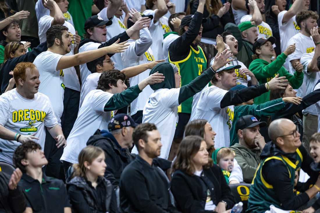 The Oregon student section yells out "airball" repeatedly after a Michigan player completely missed a shot. The Oregon Ducks men&#8217;s basketball team takes on the Michigan Wolverines on Dec. 2, 2023, in Eugene, Ore. (Molly McPherson/Emerald)