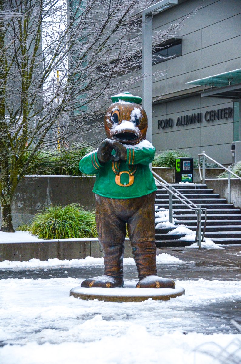 A statue of Puddles the Duck covered in snow outside of Matthew Knight Arena. The Oregon men's basketball team defeated the Cal Bears 80-73 at Matthew Knight Arena on Jan. 13. (Kai Kanzer/Emerald)