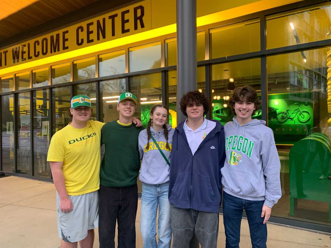 Micah Atkerson, Evan Rice, Moriah Allen, Jackson St. Denis, and Cole Klapprott stand outside of Unthank Hall on campus. (Megan Snyder/Emerald)