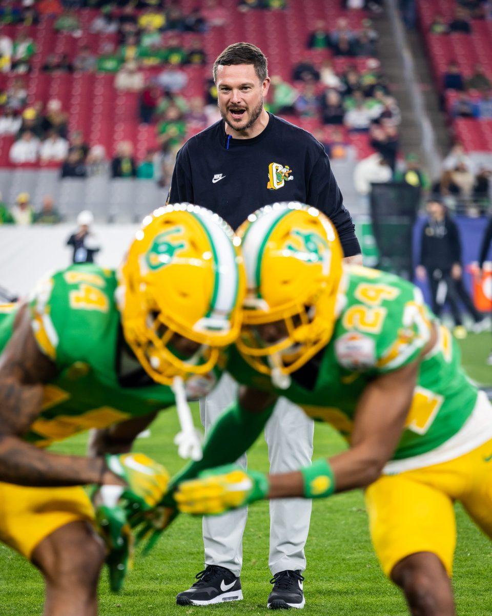 A year ago the Oregon Ducks were playing in a rather meaningless Holiday Bowl game. This year, Dan Lanning leads his team in warmups for a coveted NY6 Bowl Game in the Fiesta Bowl.&#160;The Oregon Ducks crush the Liberty Flames at State Farm Stadium in Glendale, Ariz., on Jan. 1, 2024. (Jonathan Suni/Emerald)