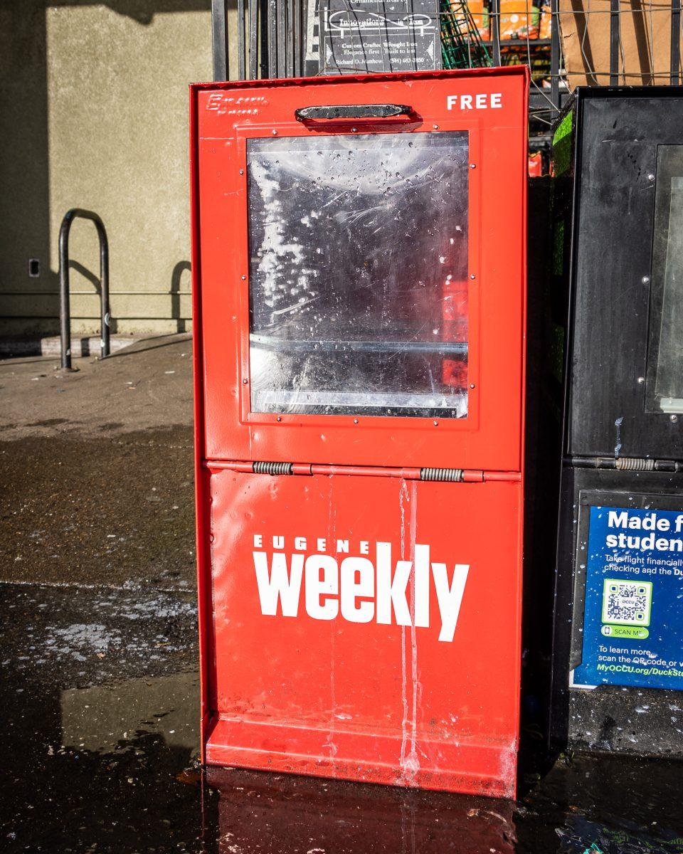 Once filled with newspapers, a Eugene Weekly stand that is located in a shopping center is now left empty. (Jonathan Suni/Emerald)