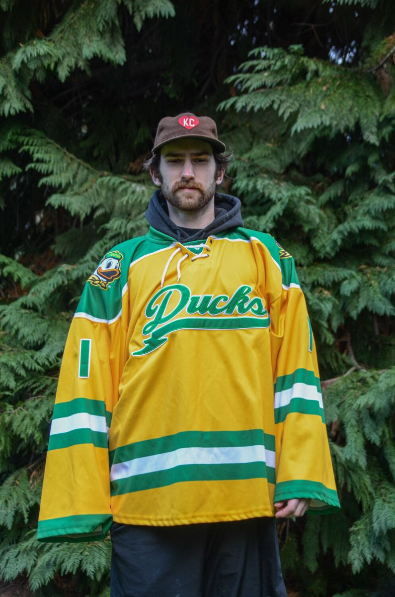 Henry Bradford, goalie, shows off the Oregon hockey team's new threads. (Kai Kanzer/Emerald)