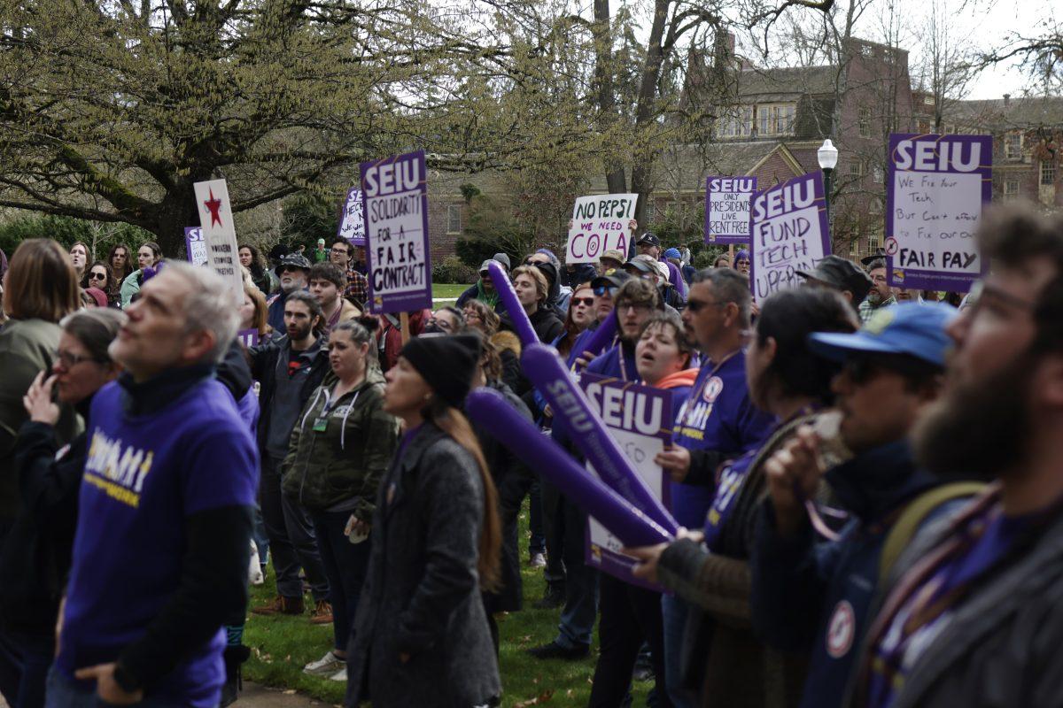 A crowd waits outside Johnson Hall as SEIU leaders deliver a petition of community support for higher education workers to UO president John Karl Scholz. (Colleen Bogdan/Emerald)