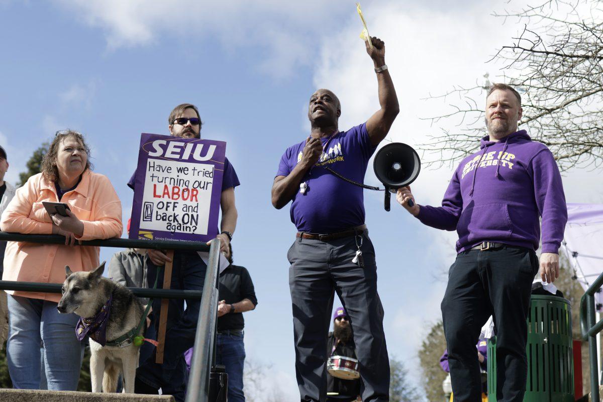 SEIU president Johnny Earl delivers opening remarks at the "Rally for Respect" in the EMU amphitheater. (Colleen Bogdan/Emerald)