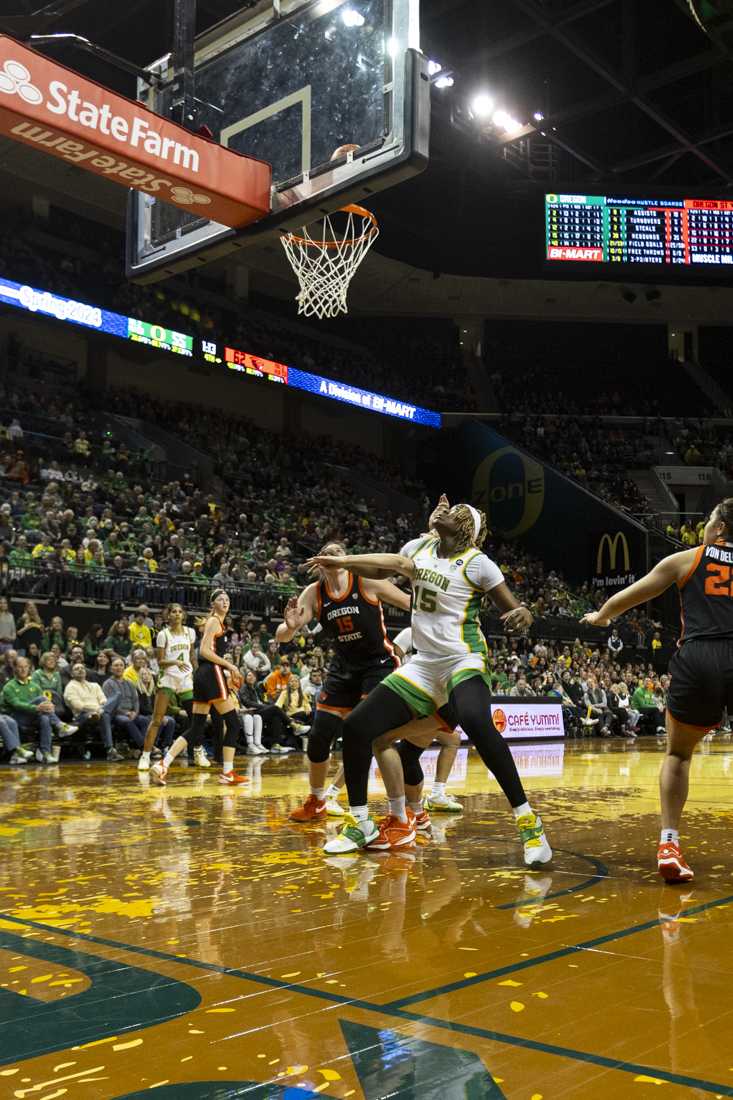 Oregon center Phillipina Kyei and Beavers Raegan Beers (15) prepare to receive a rebound. After a close second half, the Ducks lost their rivalry matchup 64-60 to the Beavers in Matthew Knight Arena on Feb. 4, 2024. (Alex Hernandez/Emerald)