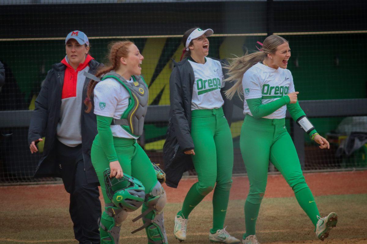 Oregon celebrates after securing the win. The Oregon Softball team came out on top in their second game against Maryland 4-2 in the Jane Sanders Classic hosted in Eugene, Ore., on March 2, 2024, at Jane Sanders Stadium. (Alyssa Garcia/Emerald)