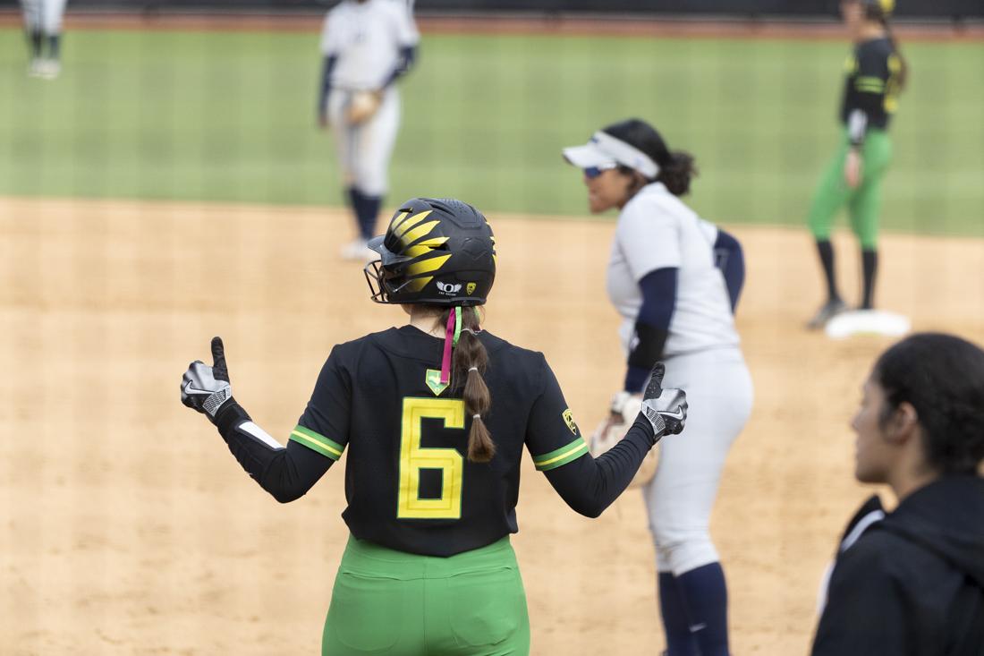 Katie Flannery (6) gives two thumbs up as she stands on first base. The Oregon women's softball team took a 5-2 win as they faced off against the University of California, Berkeley's Golden Bears at Jane Saunders Stadium on March 9, 2024. (Alex Hernandez/Emerald)