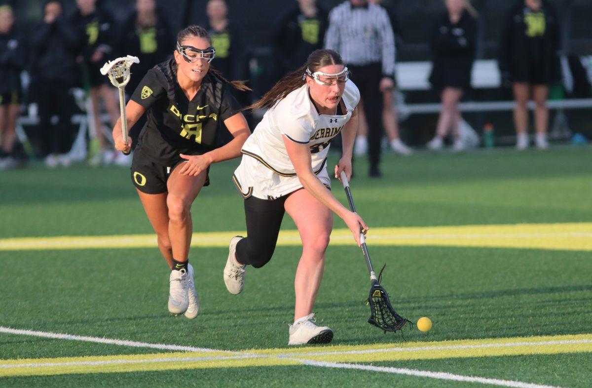 Haley Cummins (18) and Kelly Corrigan (25) race towards the ball after the face-off. The Oregon Women&#8217;s Lacrosse team walks away with a win over Merrimack College 18-3 in their first game back from being on the road at Pap&#279; Field in Eugene, Ore., on March 6, 2024. (Alyssa Garcia/Emerald)