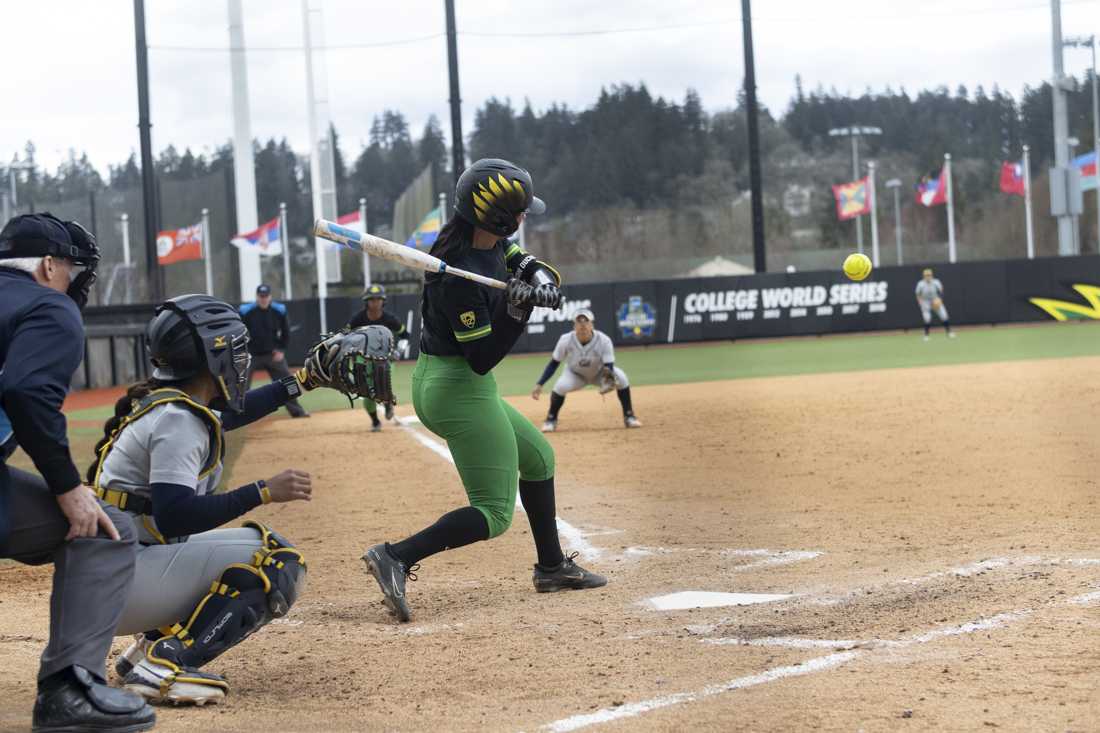 Ariel Carson (3) takes a swing at the ball. The Oregon women's softball team took a 5-2 win as they faced off against the University of California, Berkeley's Golden Bears at Jane Saunders Stadium on March 9, 2024. (Alex Hernandez/Emerald)