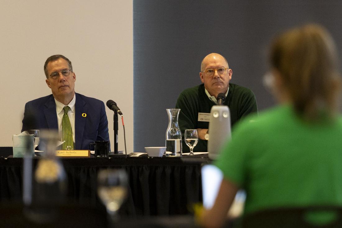 Karl Scholz and Steve Holwerda, both members of the Board of Trustees, listen to Romie Avivi Stuhl, a Jewish student, as she speaks about feeling unsafe due to demonstrations that have taken place on campus. People gathered outside of the Ford Alumni Center for a rally before the University of Oregon Board of Trustees meeting, where some spoke during the public comments section alongside other students and community members, with topics ranging from proposed "Boycott, Divest, Sanction" strategies, to Jewish students feeling unsafe due to protests and demonstrations on campus. (Alex Hernandez/Emerald)