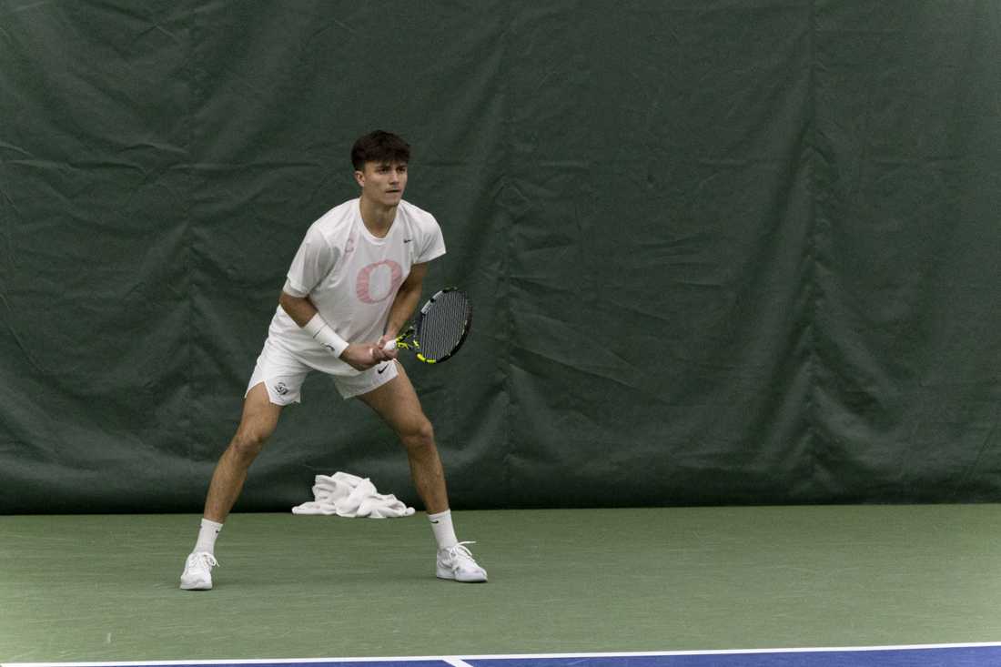 Quinn Vandecasteele prepares to receive a ball during a match on Feb. 10, 2024, as the Oregon men's tennis team faced off against the University of Nevada, Reno. (Alex Hernandez/Emerald)