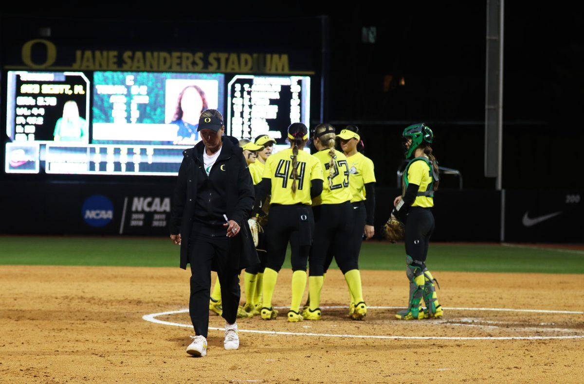 Head Coach, Melyssa Lombardi heads back to the dugout after a discussion with the players on the mound. The Oregon Softball team defeats California 4-3 in their second game against them in a doubleheader on March 8, 2024, in Eugene, Ore., at Jane Sanders Stadium. (Alyssa Garcia/Emerald)