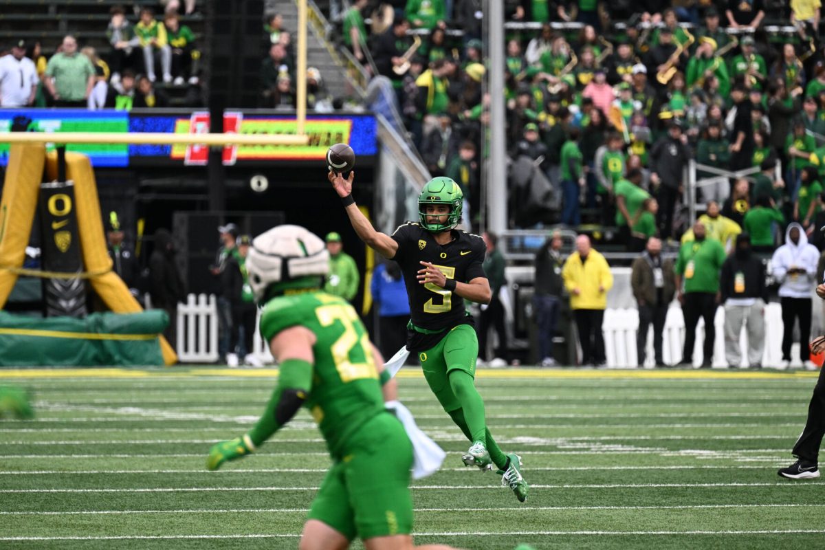 Quarterback Dante Moore (5) makes a throw on the run showing off his dual threat ability.&#160;The "Green Team" wins 28-17 during the Oregon Ducks Spring Game in Autzen Stadium on April 27, 2024. (Kai Kanzer/Emerald)