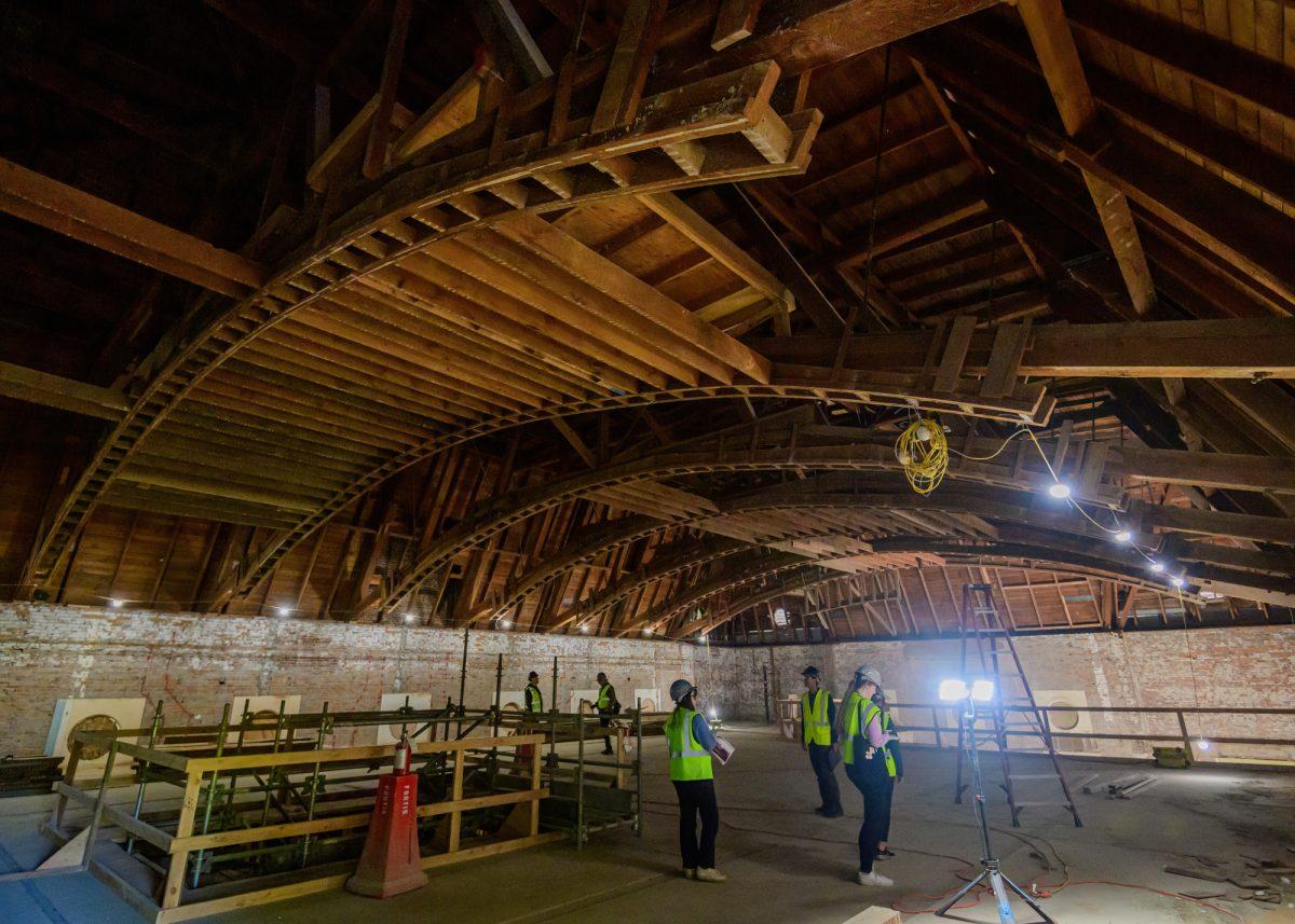 Extensive wood arches make up the roof structure of Villard Hall. University and Villard Hall, two of the oldest buildings on the grounds of the University of Oregon, undergo an extensive renovation in Eugene, Ore., on April 18, 2024. (Eric Becker/Emerald)