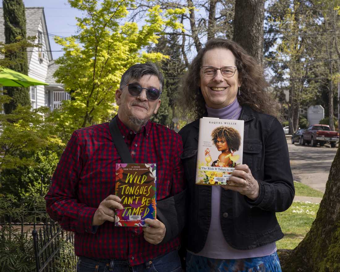 Jacob Griffin (left) and Karon Barter (right), members of the Transponder book club, pose for a portrait. (Alex Hernandez/Emerald)