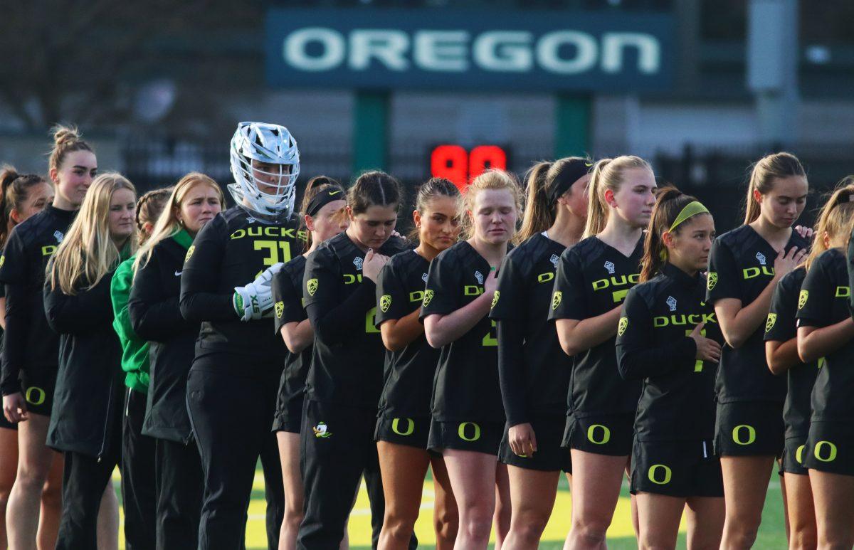 The Oregon Women&#8217;s Lacrosse team during the National Anthem. The Oregon Women&#8217;s Lacrosse team walks away with a win over Merrimack College 18-3 in their first game back from being on the road at Pap&#279; Field in Eugene, Ore., on March 6, 2024. (Alyssa Garcia/Emerald)