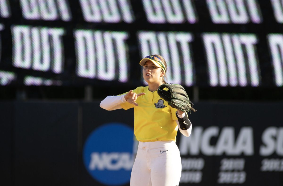 Kai Luschar (22) celebrates as Oregon gets an out. The Oregon Softball team secures the win 11-3 over Oregon State in game 1 of their Rivalry Series, hosted at Jane Sanders Stadium in Eugene, Ore., on April 19, 2024. (Alyssa Garcia/Emerald)