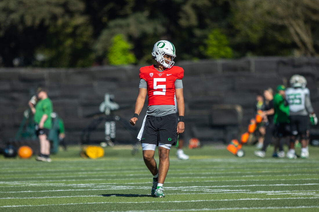 Quarterback Dante Moore (05) looks to his teammates after making a throw. The Oregon Ducks football team takes the field at the Hatfield-Dowlin Complex on a cool Thursday morning for a practice in Eugene, Ore on April 18, 2023. (Molly McPherson/Emerald)