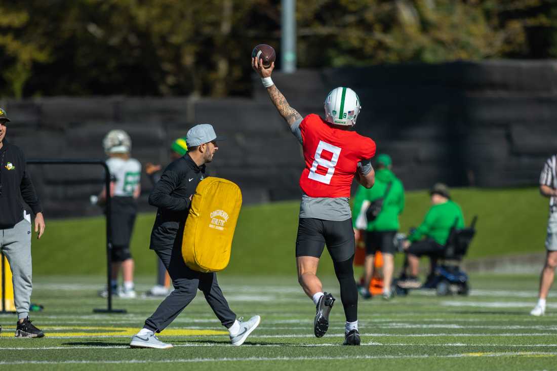 Quarterback Dillon Gabriel (08) throws the ball down the field. The Oregon Ducks football team takes the field at the Hatfield-Dowlin Complex on a cool Thursday morning for a practice in Eugene, Ore on April 18, 2023. (Molly McPherson/Emerald)