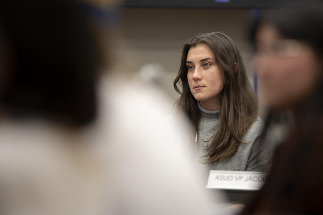 Chlo&#233; Webster, the ASUO president, listens alongside other ASUO senators as people speak in support of NASU and the Mother's Day Powwow at the senate meeting on March 13, 2024. Over 150 students and community members protested the decision made by the ASUO to schedule the spring concert on the same weekend as the 56th Annual Mother's Day Powwow, a community and cultural event planned by the Native American Student Union. (Alex Hernandez/Emerald)