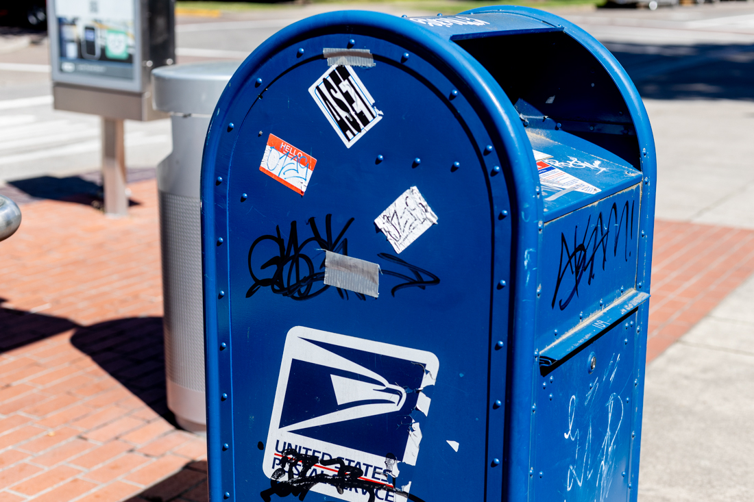 A mailbox outside of the Lillis Business Complex is covered in graffiti and stickers. Vandalism in campus buildings continues to increase as the end of Spring term approaches. (Kemper Flood/ Emerald)