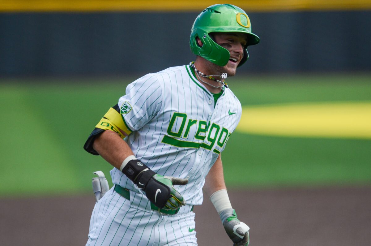 Mason Neville (26) rounds third base after hitting his second home run of the day. (Kai Kanzer/Emerald)