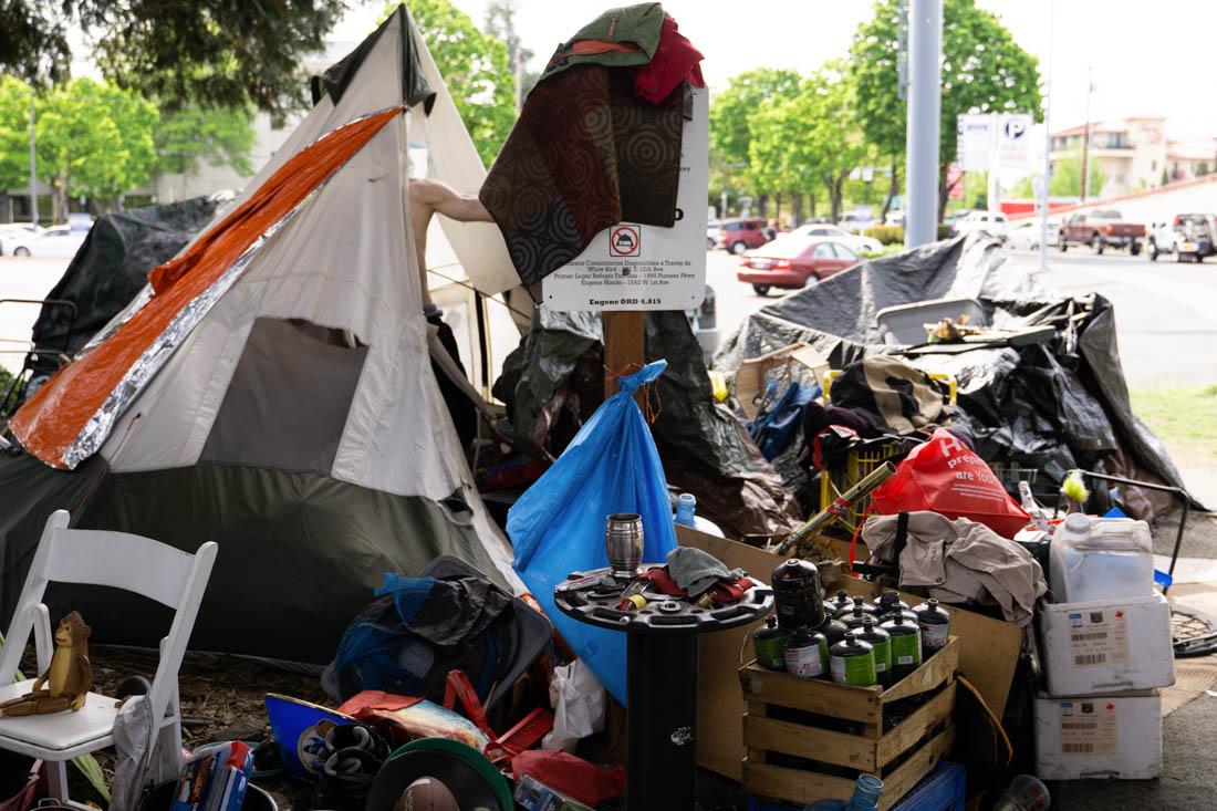 A community of houseless individuals reside underneath Coburg Road in Eugene, Ore., on May 5, 2021. (Ali Watson/Emerald)