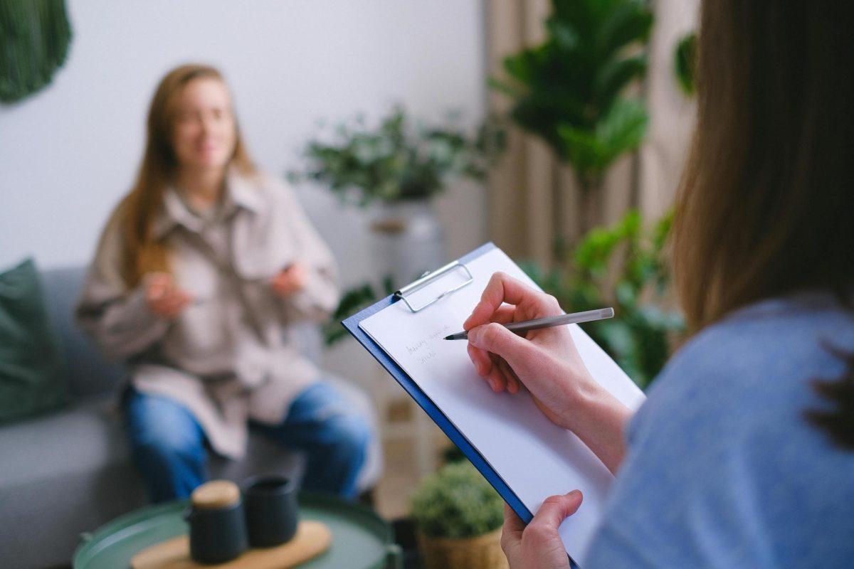 https://www.pexels.com/photo/crop-psychologist-taking-notes-during-appointment-7176026/