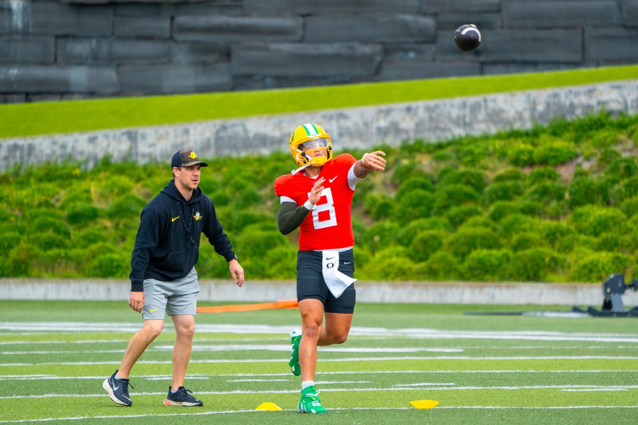 Dillon Gabriel(8) in passing drills at Oregon football practice at the practice facility. (Spencer So/Emerald)