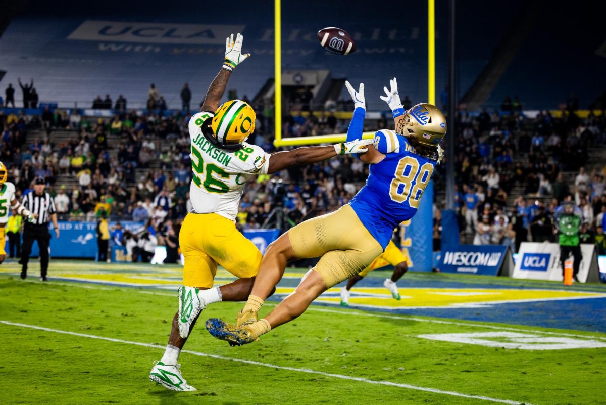 Devon Jackson (26) disturbs former Duck, Moliki Matavao (88), just enough to stop a big catch. The Oregon Ducks take on the UCLA Bruins in its first Big Ten Conference game in the Rose Bowl in Pasadena, CA on Sept. 28, 2024. (Jonathan Suni/Emerald)