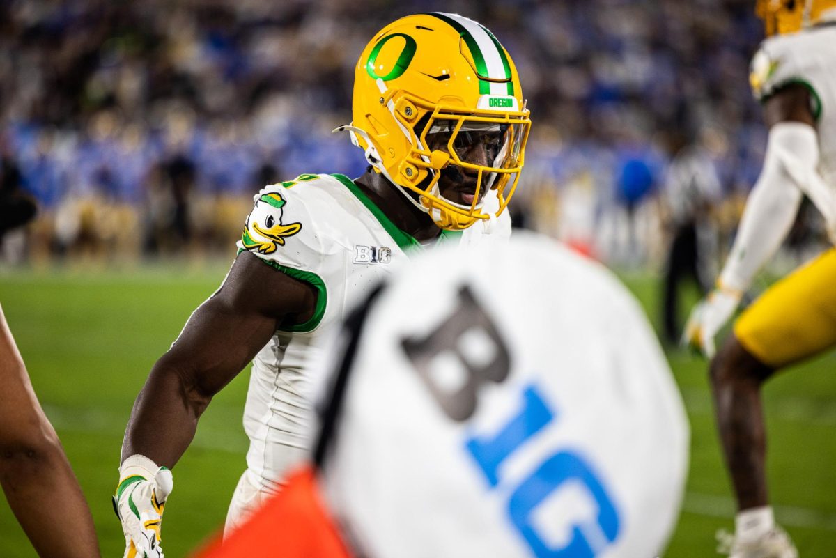 Jeffrey Bassa (2) reaches his hand out to his teammates as they prepare to take the field. The Oregon Ducks take on the UCLA Bruins in its first Big Ten Conference game in the Rose Bowl in Pasadena, CA on Sept. 28, 2024. (Jonathan Suni/Emerald)