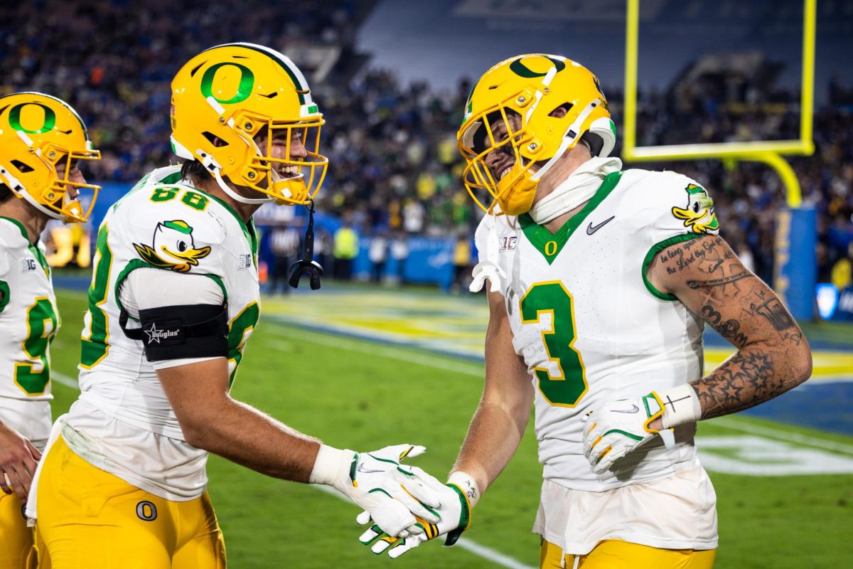 Tight ends Patrick Herbert (88) and Terrance Ferguson (3) celebrate an exciting two point conversion. The Oregon Ducks take on the UCLA Bruins in its first Big Ten Conference game in the Rose Bowl in Pasadena, CA on Sept. 28, 2024. (Jonathan Suni/Emerald)