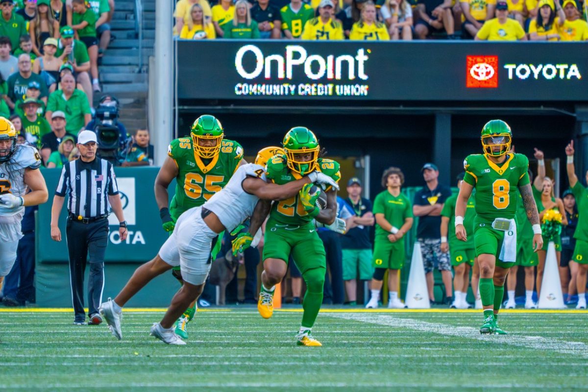 Jordan James(20) bullies his way down field. The University of Oregon Ducks Football team played the University of Idaho in a home match at Autzen Stadium in Eugene, Ore., on August 31st, 2024. (Spencer So/Emerald)